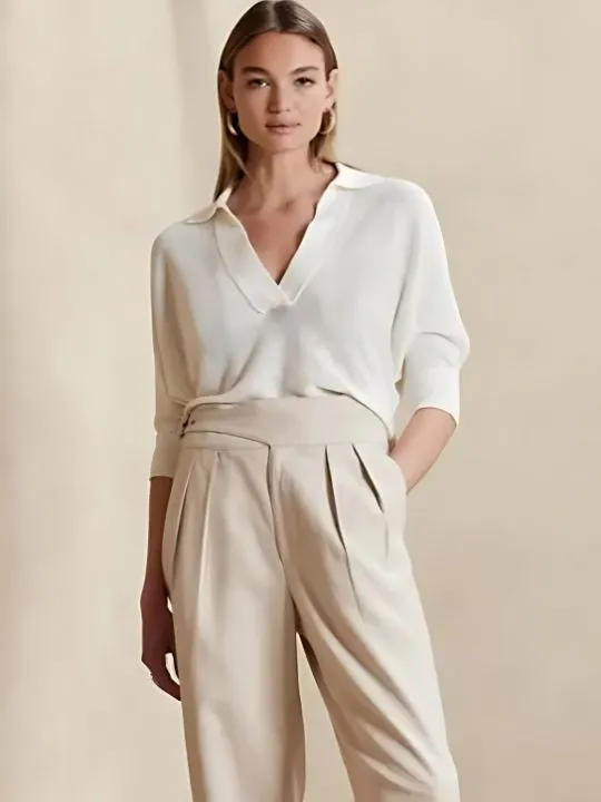 woman wearing white blouse tan pants